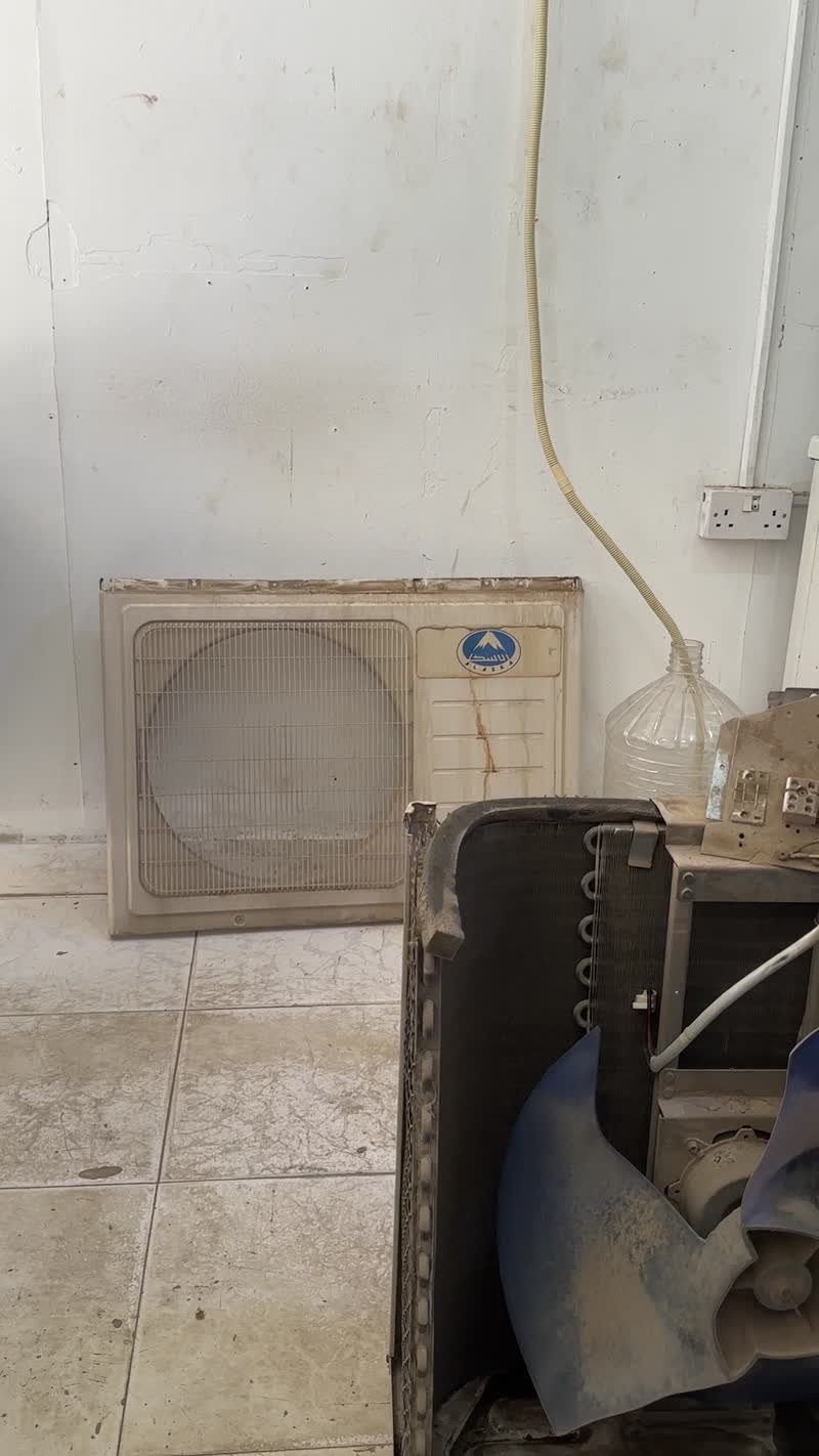 Video showing AC condenser repair work in progress