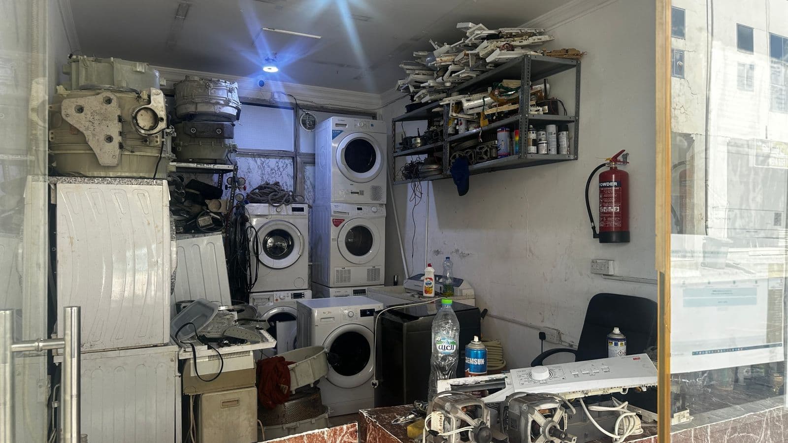 Inside the repair workshop with washers, dryers, motors and control boards